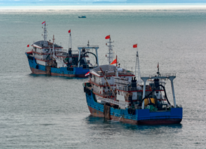 Chinese commercial fishing boats moored on the outer anchorage in Strait of Singapore.