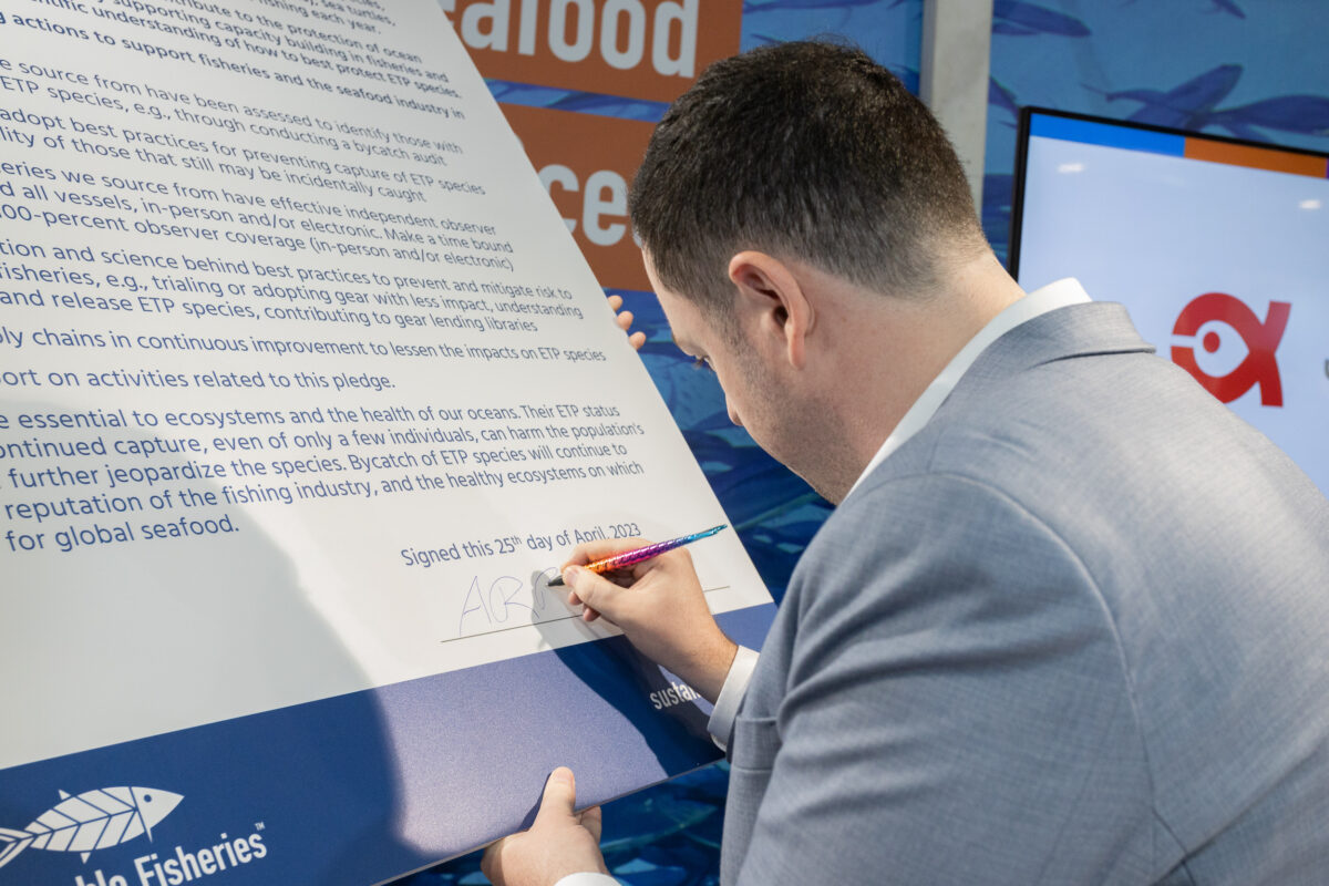 Adam Brennan of Thai Union signs the Protecting Ocean Wildlife Pledge