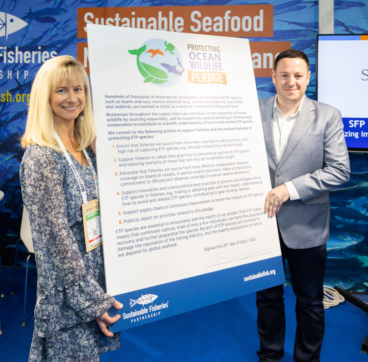 Kathryn Novak and Adam Brennan with Protecting Ocean Wildlife pledge