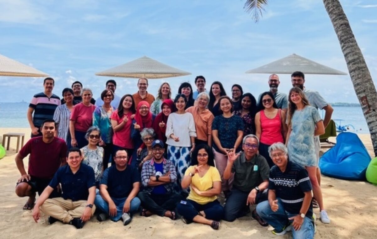 Group shot of SFP staff on the beach at the 2022 Fisheries Team meeting in Bali 2022