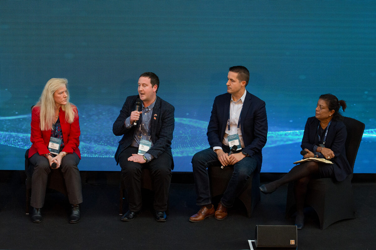 Lisa Goche, William Davies, Jason Berryhill, and Indrani Lutchman speaking on a panel at the 2024 GSA Responsible Seafood Summit.