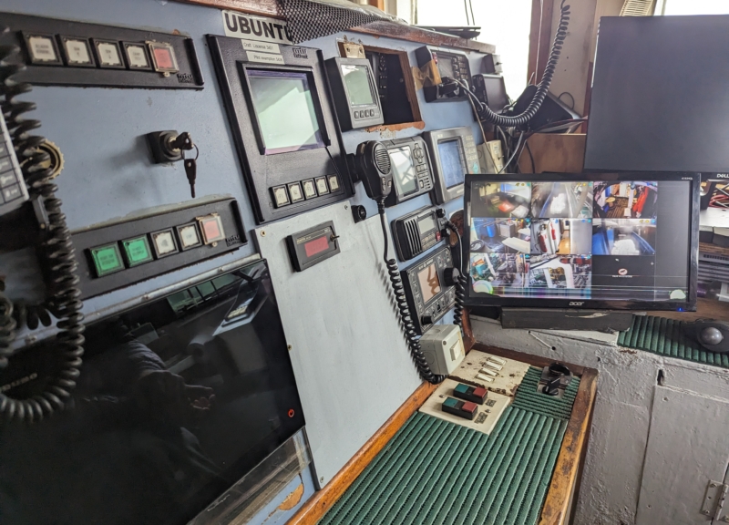 Bank of electronic equipment on a longline fishing vessel, including a screen showing images from the cameras used for electronic monitoring