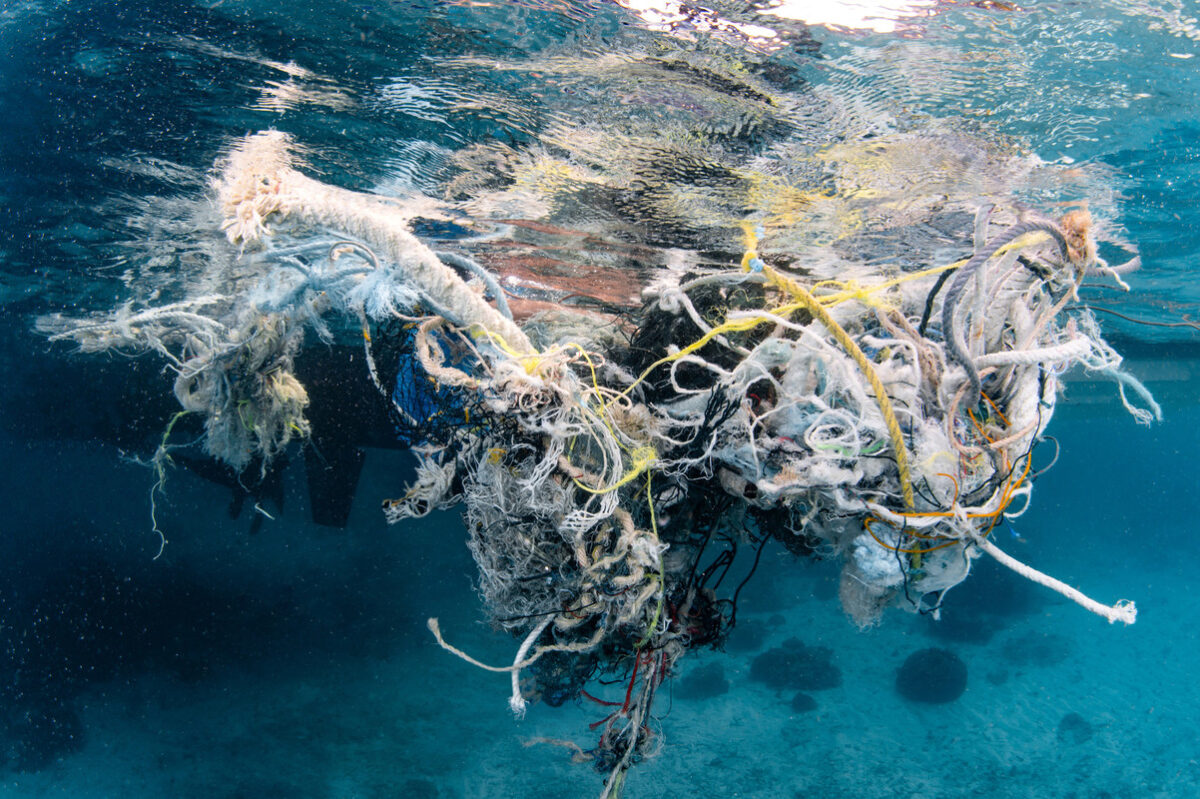 Ghost gear, including tangled fishing nets, floating in the ocean