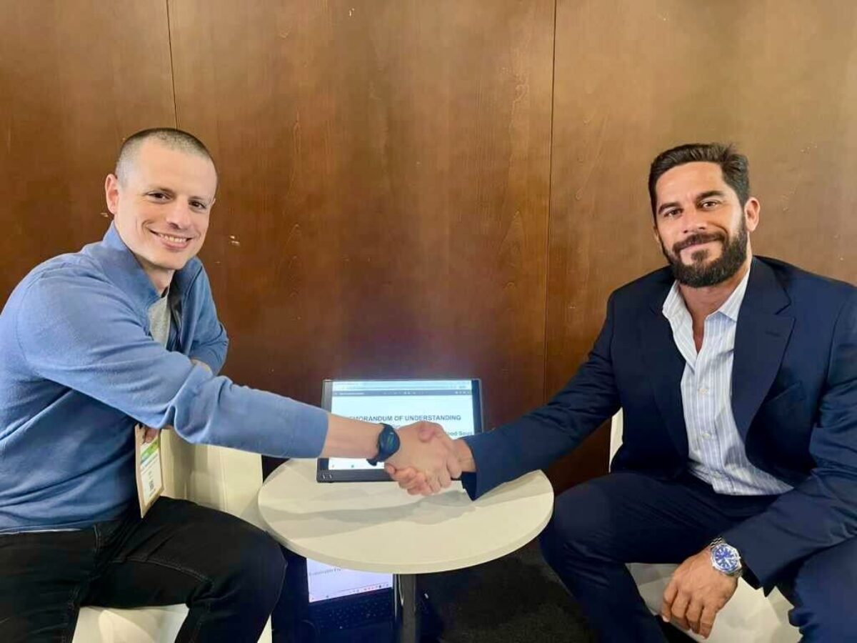 SFP and Seafood Souq representatives shaking hands after signing an MoU