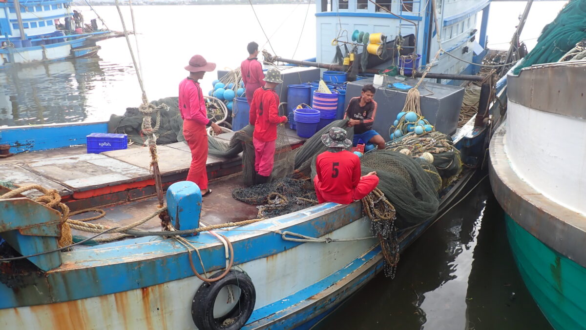 fishermen on a boat in the gulf of thailand