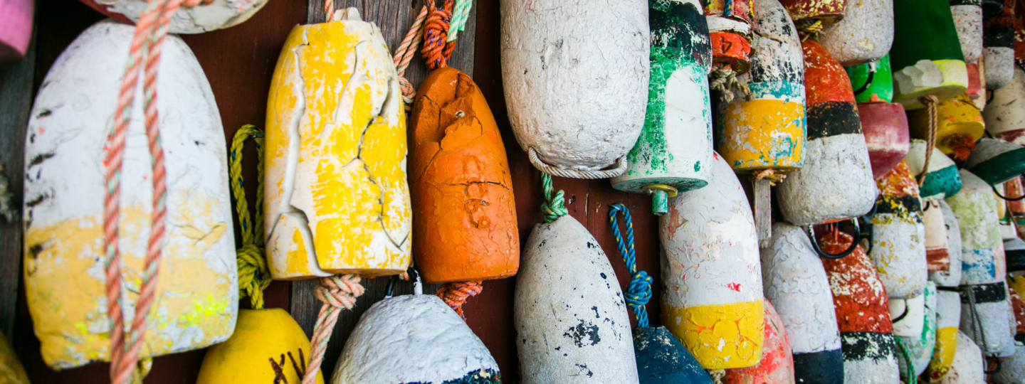 Colorful buoys hanging on a wall