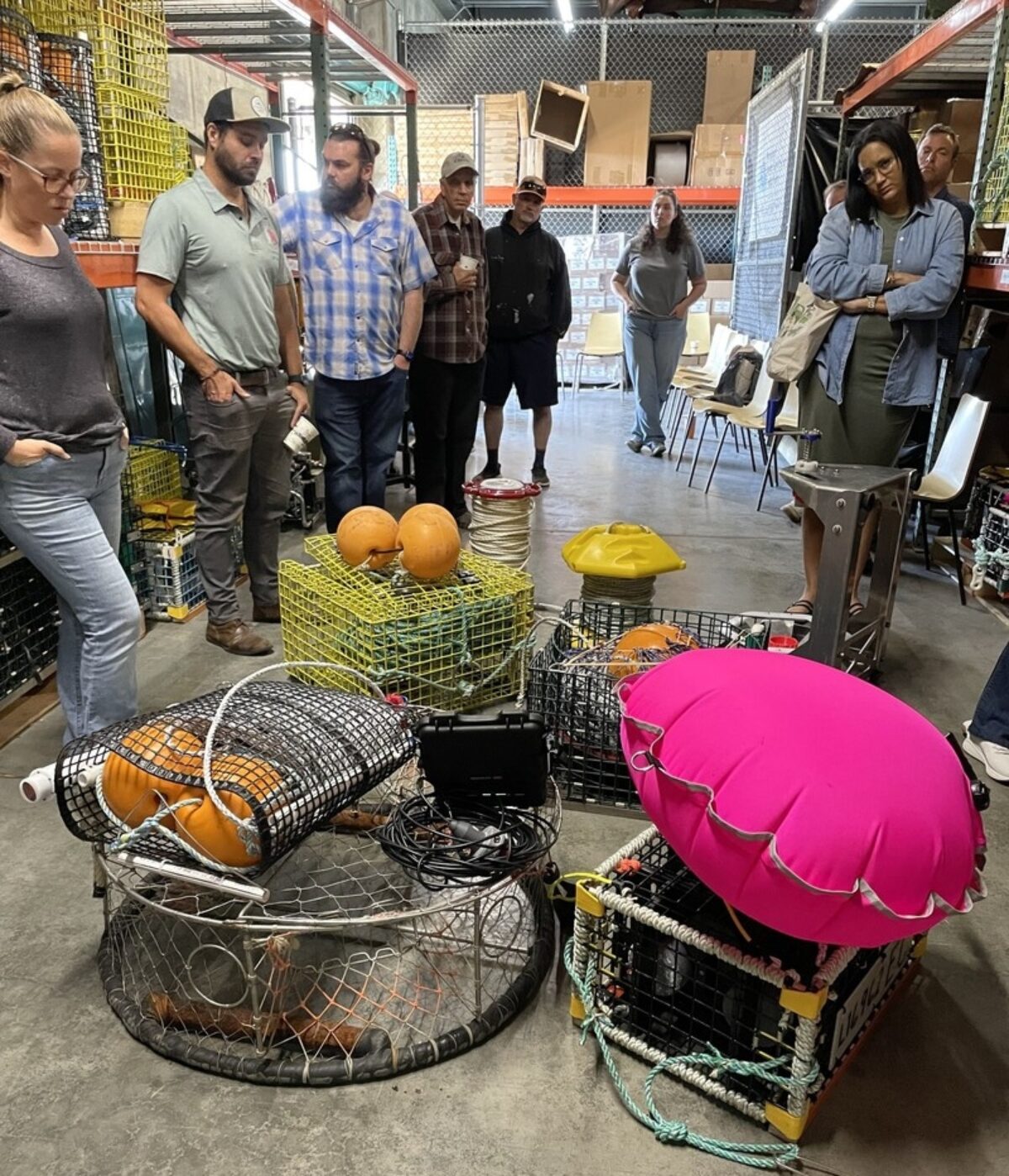 NMSF Gear Library tour participants looking at a variety of on-demand gear